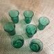 Series of 7 green glasses