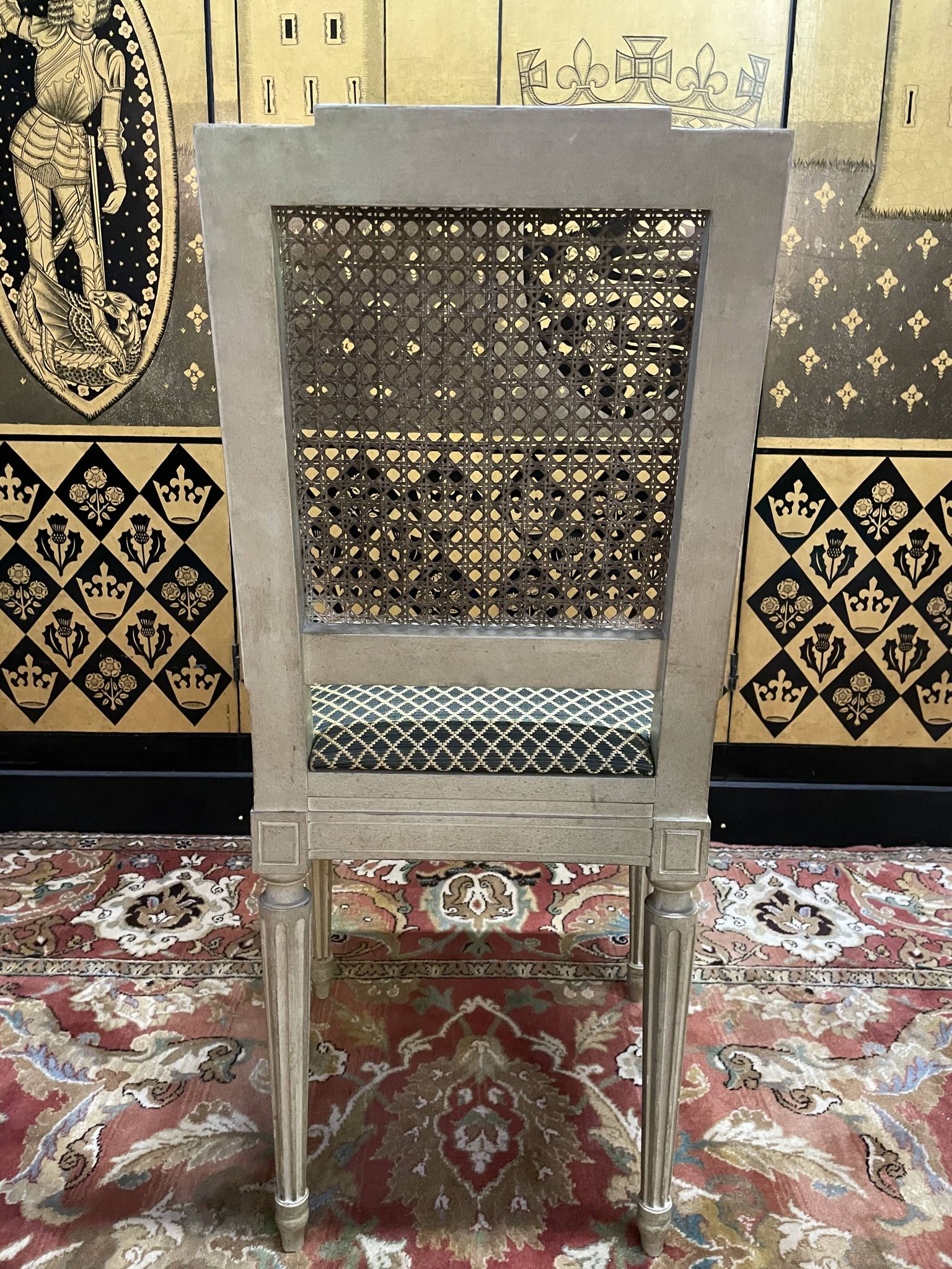 Suite de 4 chaises cannées style Louis XVI Jean Mocque