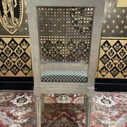 Suite de 4 chaises cannées style Louis XVI Jean Mocque