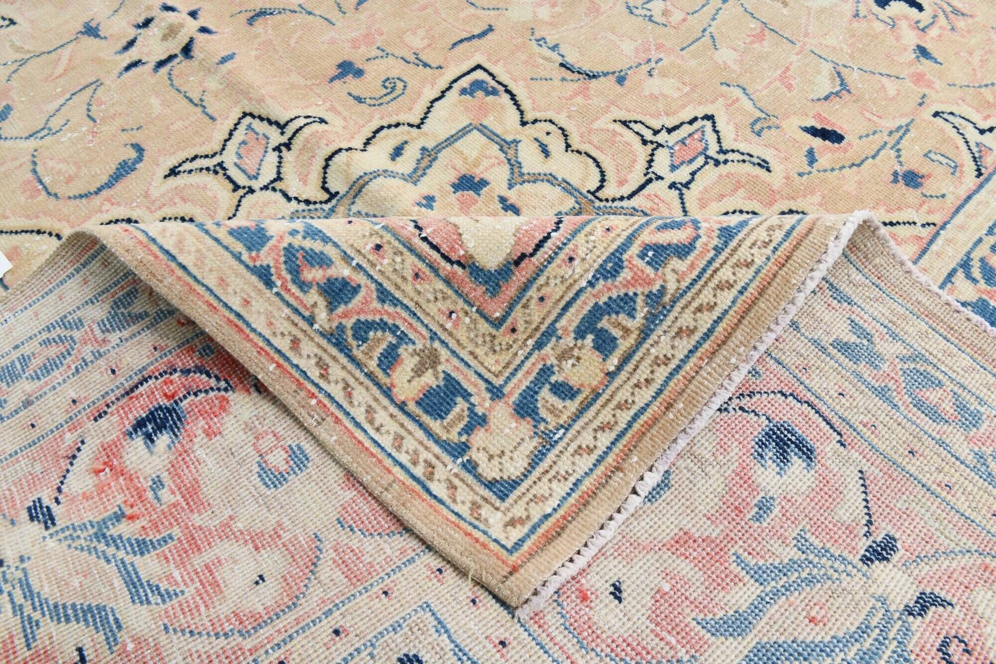Antique Turkish wool rug in faded floral patterns, 10 x 13 feet.