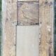 Miroir façade en bois sculpté, encadré de 2 colonnes et chapiteaux dorés