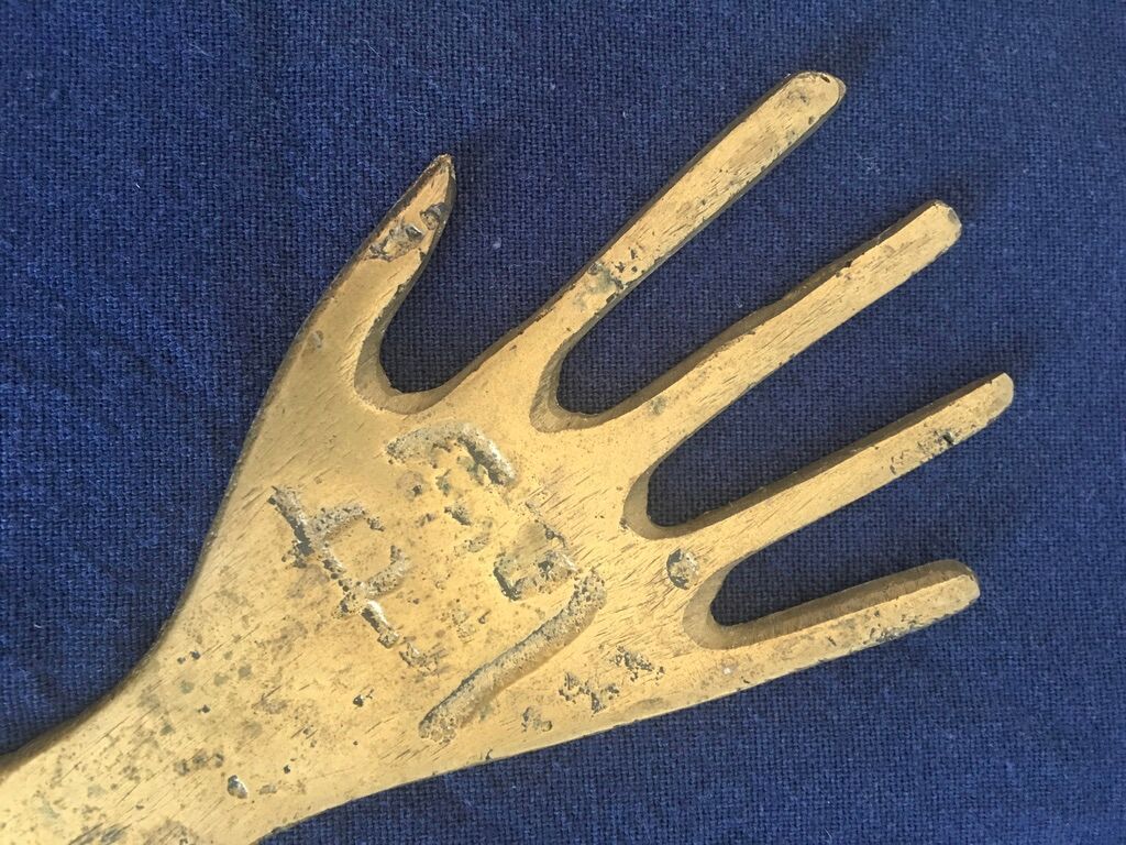 Hand-shaped brass stripper