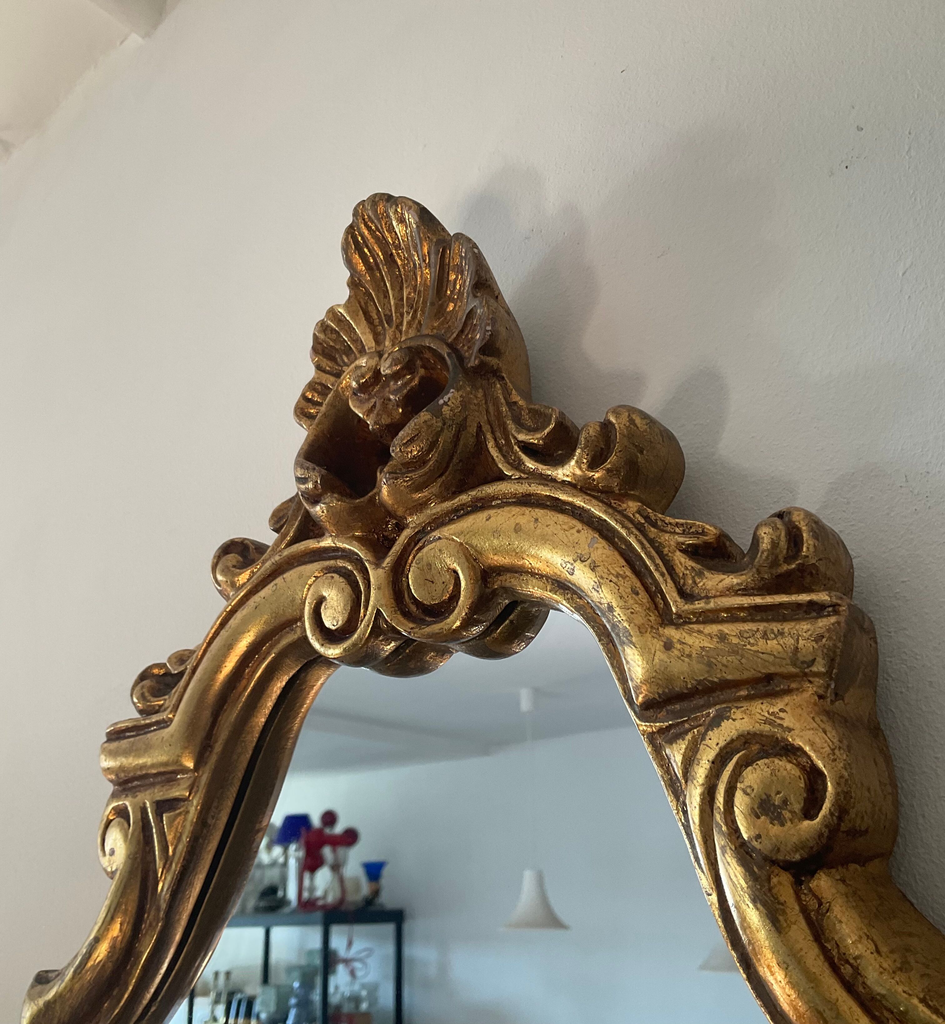 Old italian mirror in gilded plaster with leaf