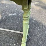 Old table with patinated green legs