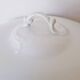 White porcelain soup tureen from Limoges with a vegetal scroll design.