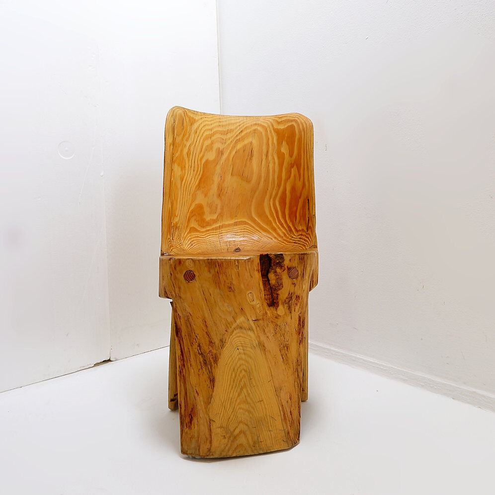 Brutalist sculptural chair in solid oak in wabi-sabi style.