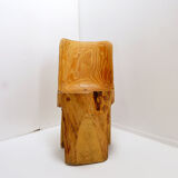 Brutalist sculptural chair in solid oak in wabi-sabi style.