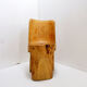 Brutalist sculptural chair in solid oak in wabi-sabi style.