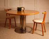 Circular dining table
