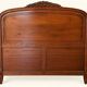 Double bed Louis XV carved walnut with roses and cabriole legs.