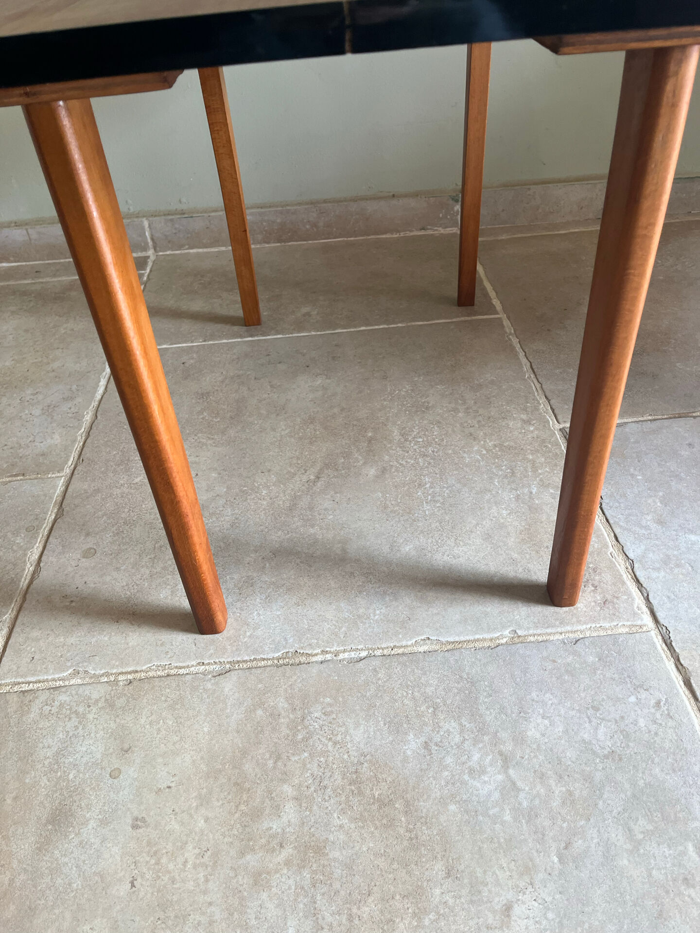 Mid-century coffee table with tapered legs.