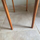 Mid-century coffee table with tapered legs.