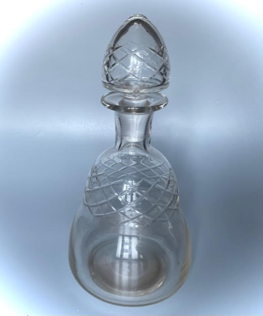 Old carafe in blown glass pattern engraved braces
