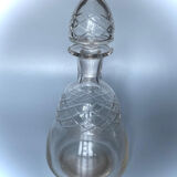 Old carafe in blown glass pattern engraved braces