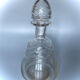 Old carafe in blown glass pattern engraved braces