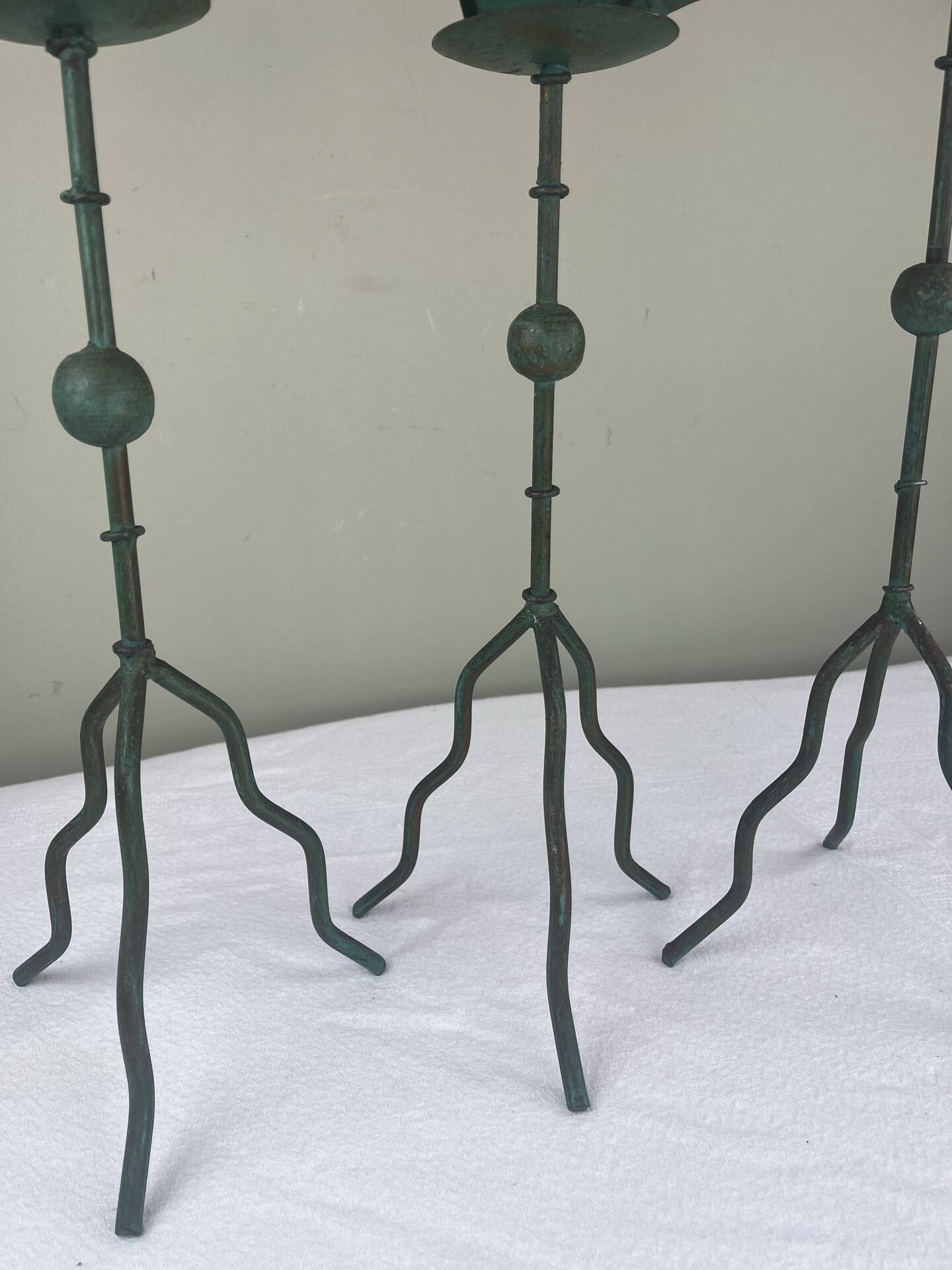 Sculptural candle holder trio