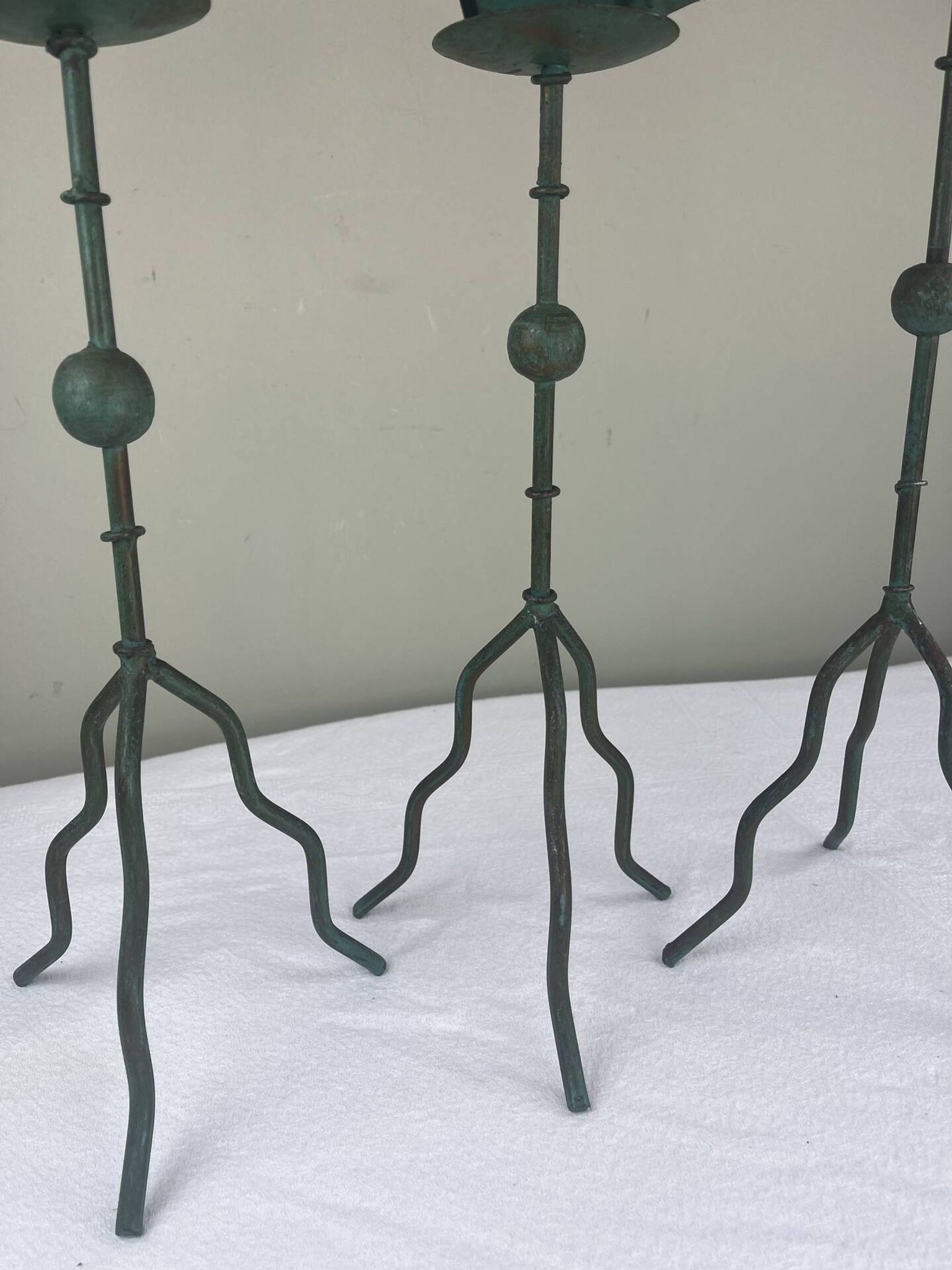 Sculptural candle holder trio
