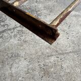 19th-century dark brown wrought-metal rocking chair with cognac leather sling seat, vintage