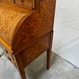 Cylinder desk with marquetry featuring a crosshatch design.