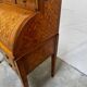 Cylinder desk with marquetry featuring a crosshatch design.