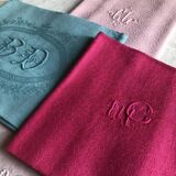 Suite of four antique tinted napkins