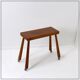 Vintage solid wood side table on casters