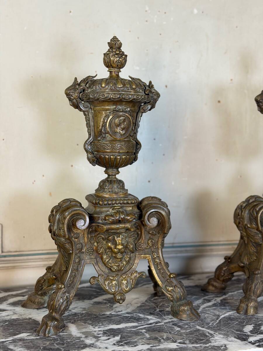 Pair of Louis XIV style andirons in bronze after a design by André-Charles Boulle.