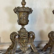 Pair of Louis XIV style andirons in bronze after a design by André-Charles Boulle.