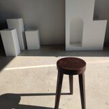 Small high tripod stool in brown solid wood