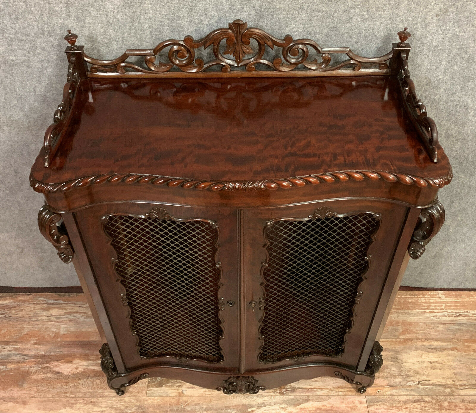 Exceptional furniture for this Napoleon III period living room library in curved mahogany shape