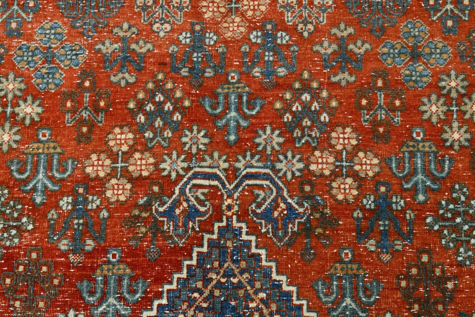 Vintage Turkish rug in brick red and indigo with floral design, 276 × 389 cm