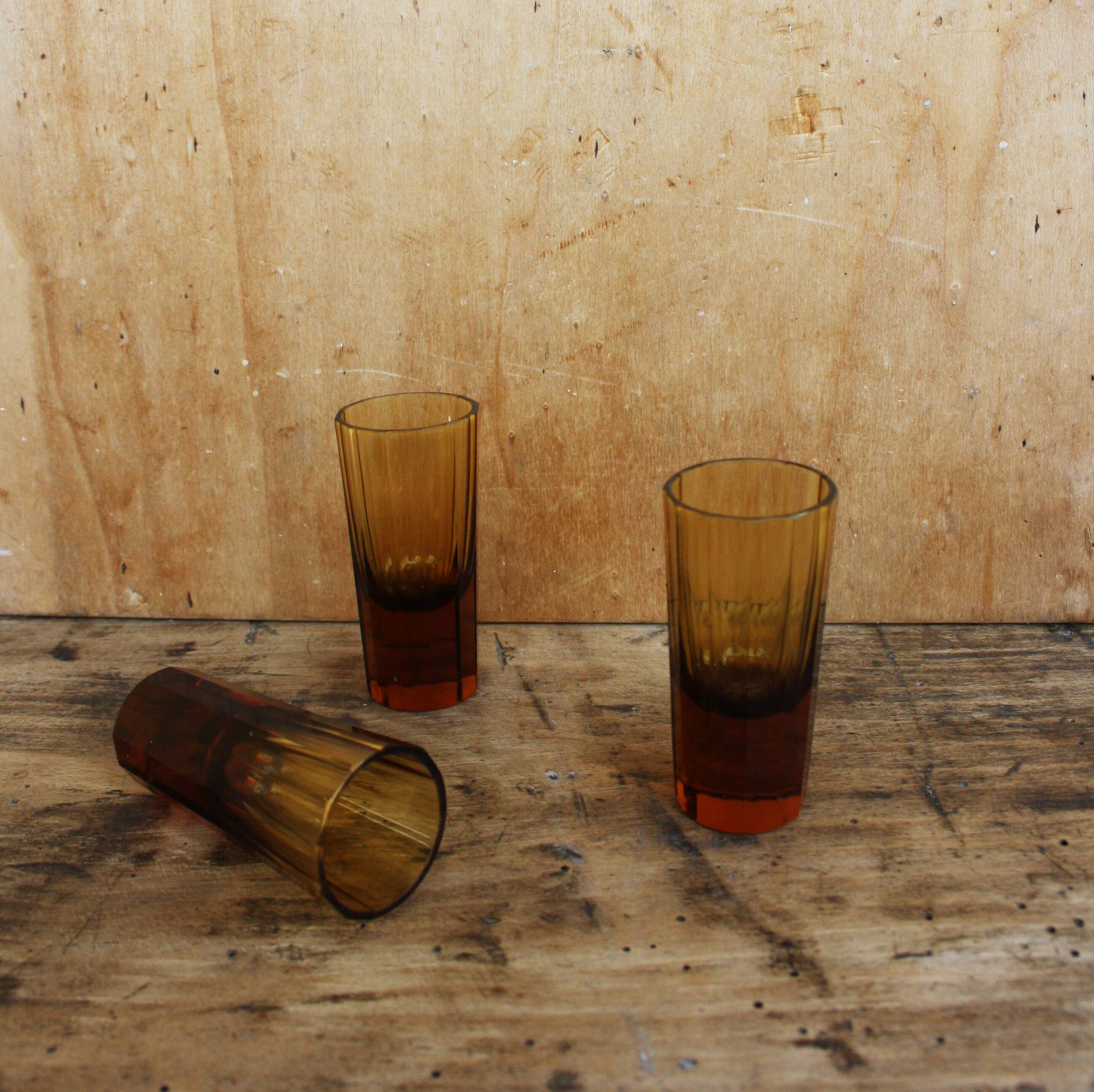 Three vintage shot glasses