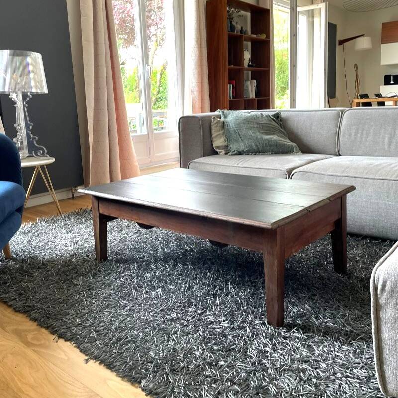 Wooden coffee table with black top