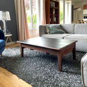 Wooden coffee table with black top