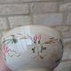 Old opaque porcelain bowl from Gien with a floral decoration.