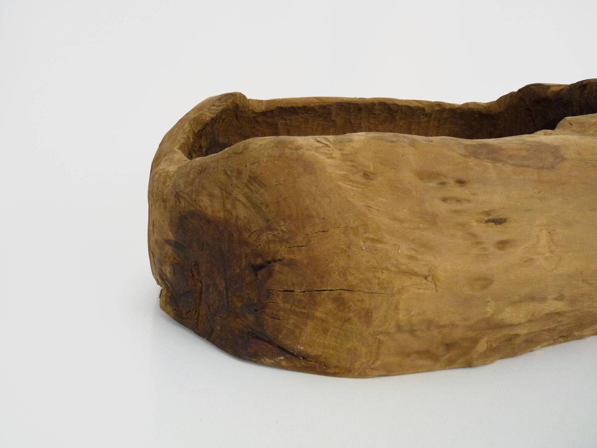 Old wooden farm water trough. Centerpiece, floral decoration. 1950