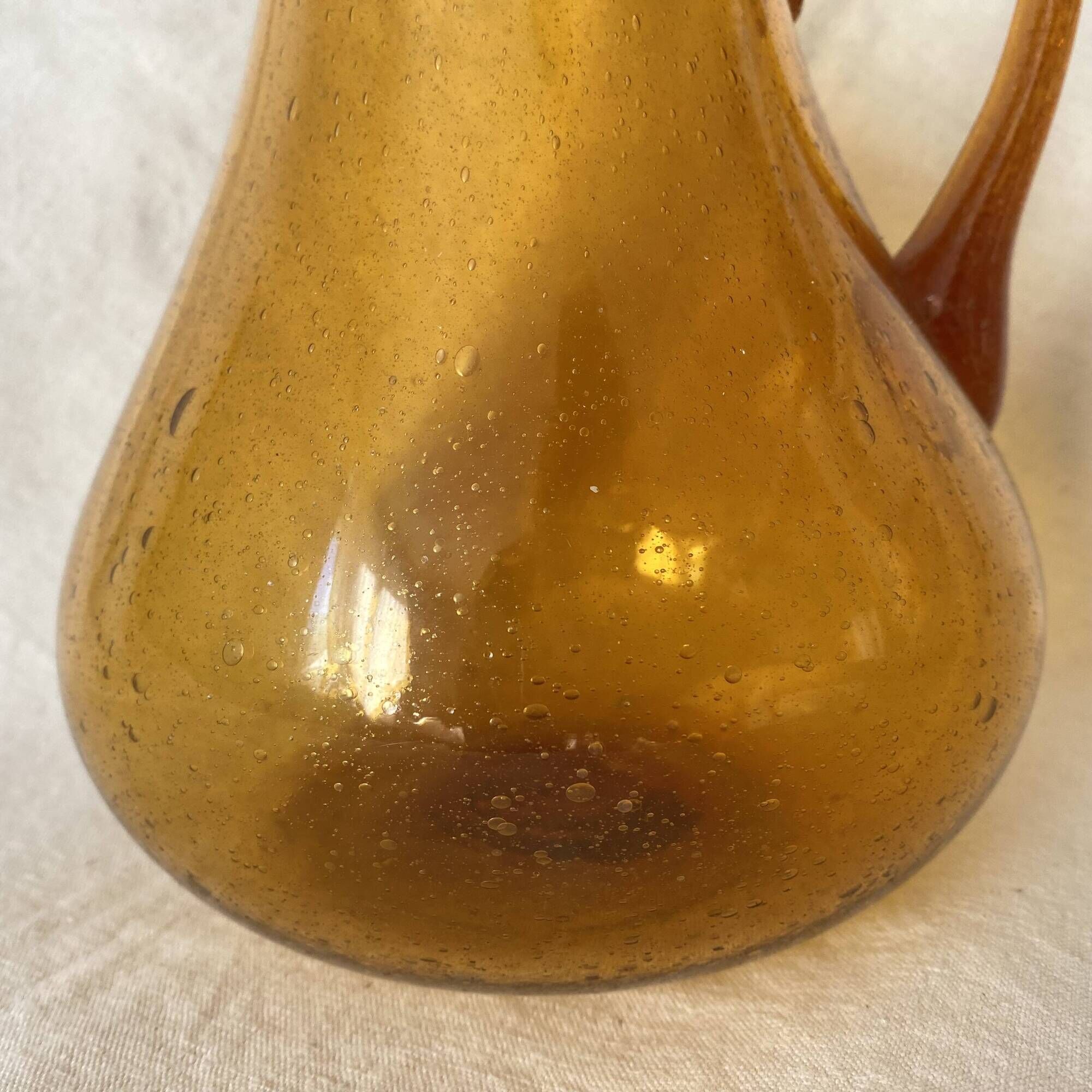 Blown glass jug with caramel bubbles