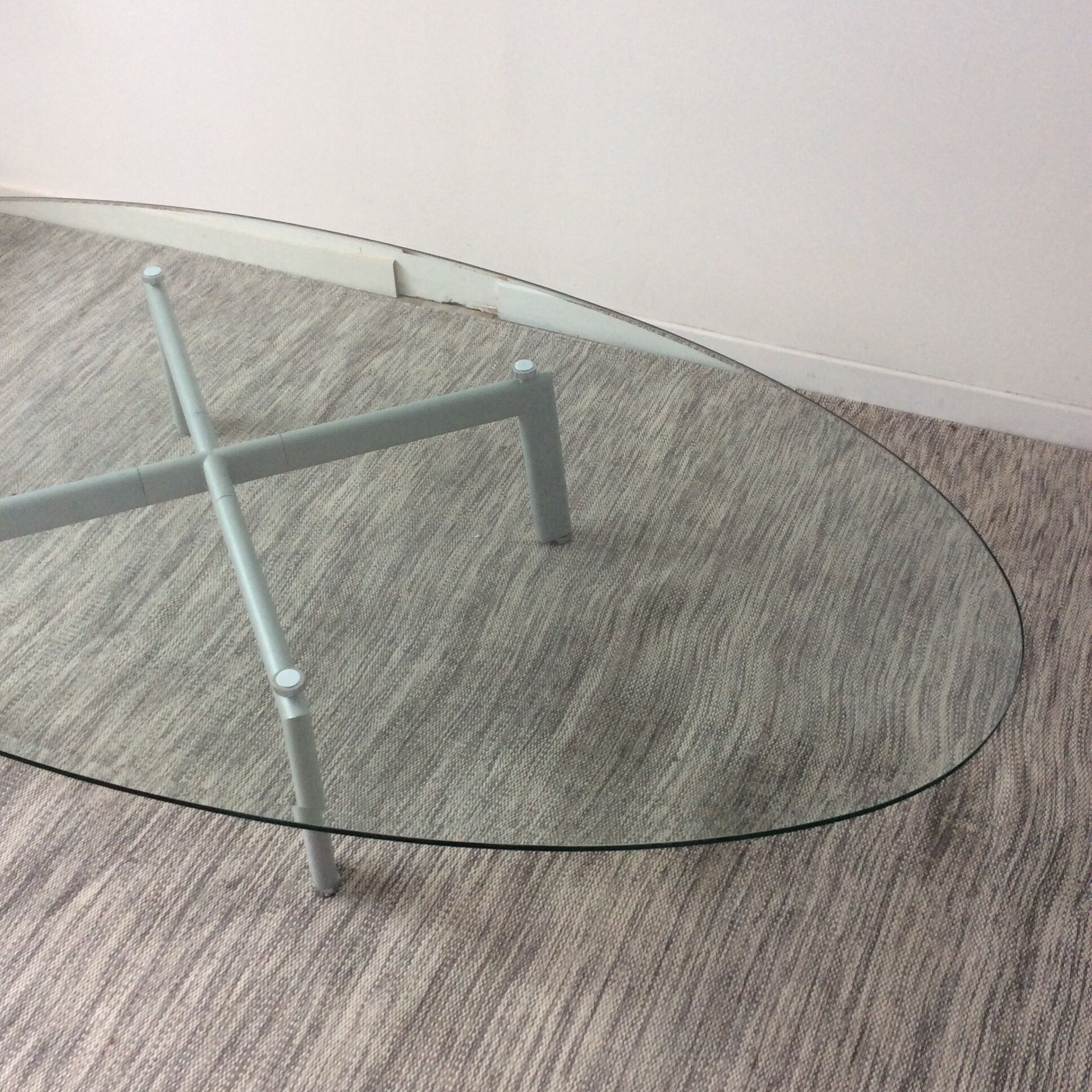 Design coffee table in beveled glass and steel foot