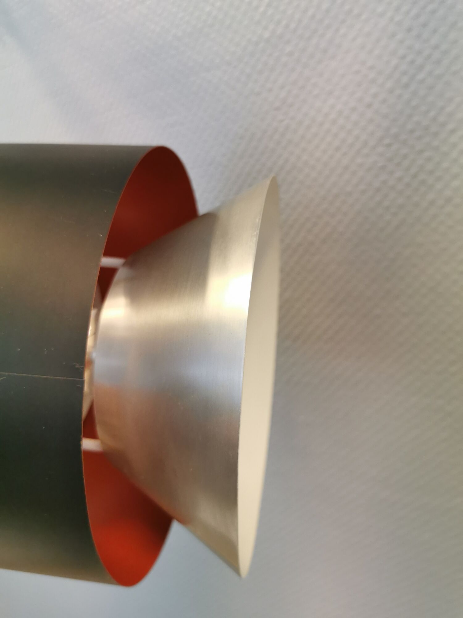 Hanging lamp,  of silver coloured aluminium with black "ring" and orange inner contrast lacquer.