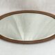 Oval beveled mirror surrounded by light wood dimension: height -74,5cm- width -38,5cm- prof-2cm-