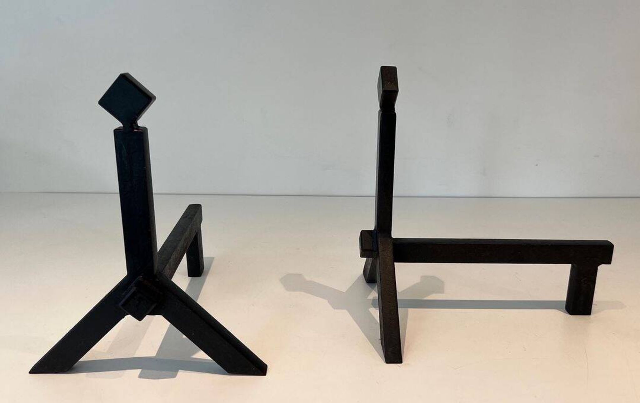 Pair of Modernist Black Iron Andirons with Diamond Finials and Angled Bases