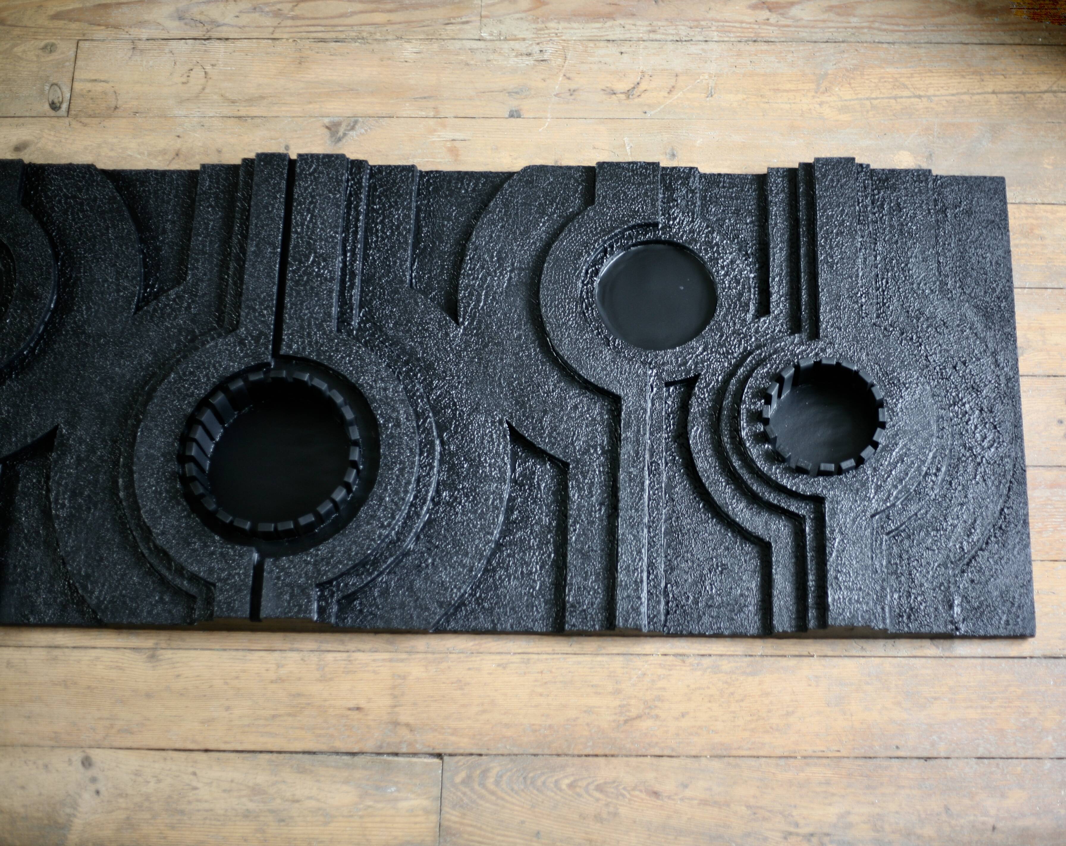 Wall sculpture, wood and black coating, late 1970s