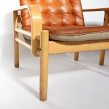 Upholstered leather armchairs 70s