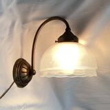 Brass wall light with a glass globe dimension: height -21cm- width -27cm-