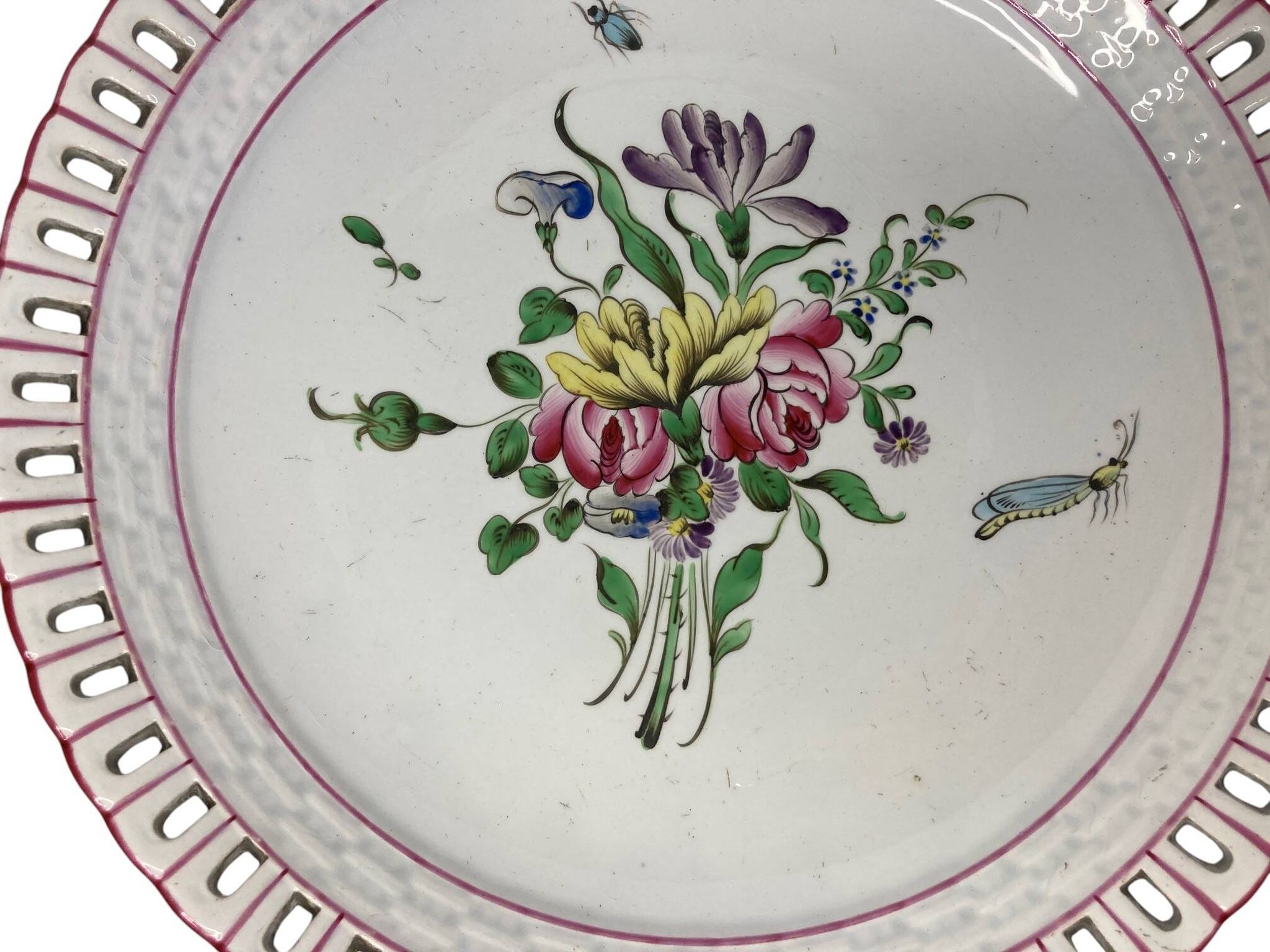Lunéville, two floral earthenware bowls with pierced edges from the early 20th century.
