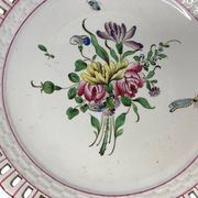 Lunéville, two floral earthenware bowls with pierced edges from the early 20th century.