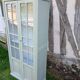Parisian style display cabinet with 2 doors and 3 shelves in Luxembourg green.