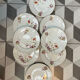 8 assiettes en porcelaine fleurie, fin XIXeme