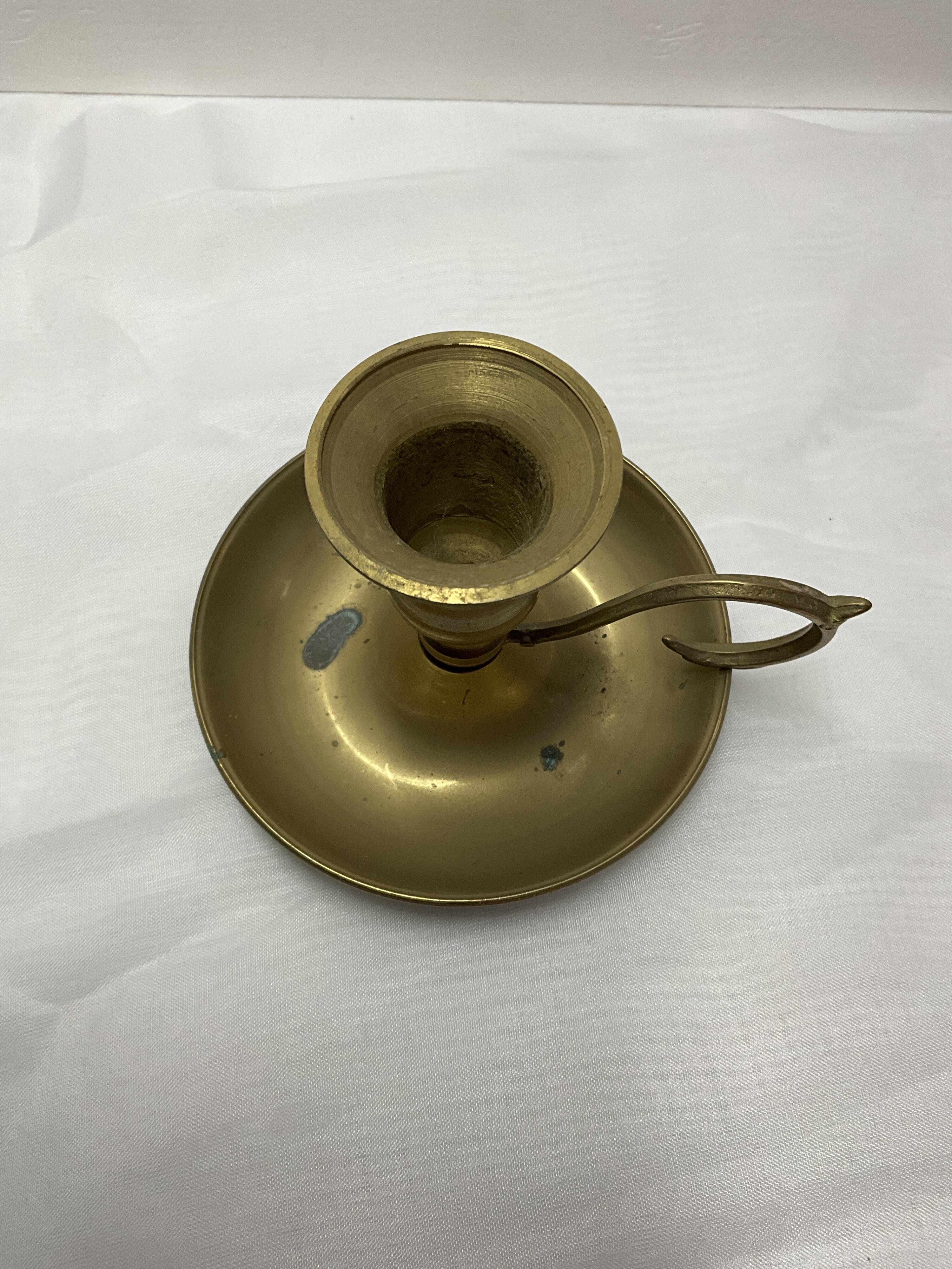 Brass hand candle holder