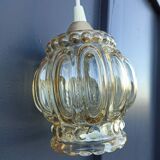 Suspension in molded glass golden reflection